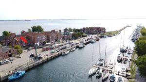 a group of boats are docked in a marina at Lachmoewe in Orth