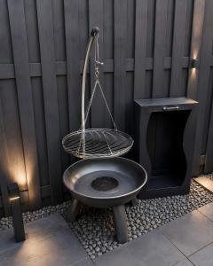 a toilet with a basket on top of it at Ferienwohnung Bailey in Laupheim +68 photos