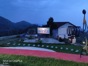 a large screen tv sitting in a yard at Salberry Hotel in Lansdowne