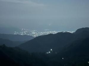 a view of a city from a mountain at night at Salberry Hotel in Lansdowne