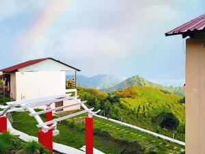 a white bench sitting on top of a green hill at Salberry Hotel in Lansdowne