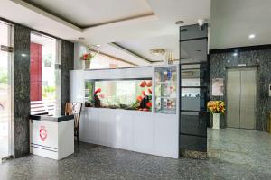 a large fish tank in a room with at Golden Gate Hotel in Bagam