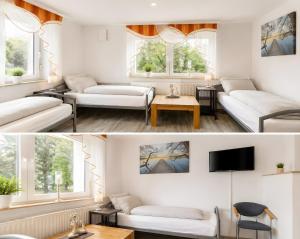 a living room with white furniture and windows at Ferienwohnung Gartenblick in Laupheim