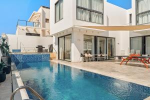 an image of a house with a swimming pool at Villa Marbella Eilat in Eilat