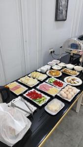 a table with many plates of food on it at Suleyman hotel in Bukhara