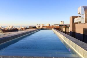 a swimming pool on the roof of a building at THREE43 ON B - Fluent Serviced Apartments in Cape Town +11 photos