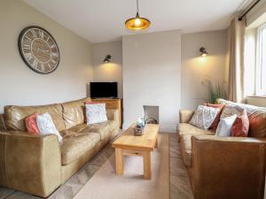 a living room with two couches and a coffee table at Ivet Lowe in Matlock