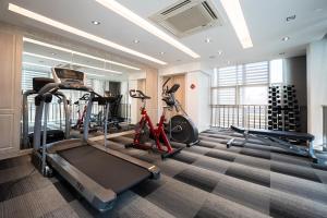 a gym with two treadmills and two exercise bikes at Koon Hotel Sukhumvit in Bangna +31 photos