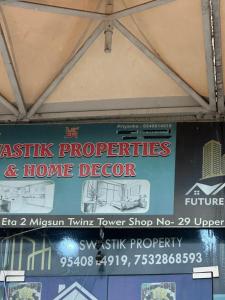 a sign in the window of a home depot at Luxura stays in Greater Noida