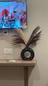 a pair of scissors sitting on top of a desk at Luxura stays in Greater Noida