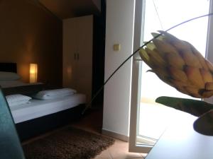 Postel nebo postele na pokoji v ubytování Guest house Garfild 2