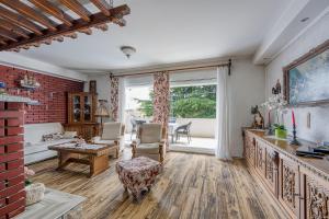 a living room filled with furniture and a large window at Pool & Garden Apartment Bakija - Happy Rentals in Pakoštane +31 photos