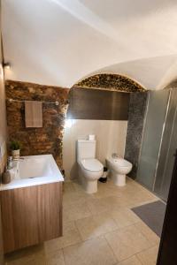 a bathroom with a tub and a toilet and a sink at Moonlight Etna B&B Catania in Catania +37 photos