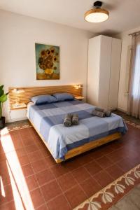 a bedroom with a large bed in a room at Moonlight Etna B&B Catania in Catania
