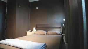 a bedroom with a bed with two pillows at Beauty apartment 3 rooms wi-fi in Netanya