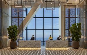 a lobby with people sitting at desks in front of a large window at Park Hyatt Kuala Lumpur in Kuala Lumpur +82 photos