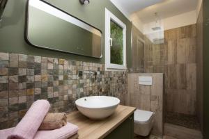 a bathroom with a sink and a mirror on the wall at Eco-Friendly Apartments in Valencia