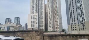 a group of tall buildings in a city at Lunar House in Hyomoktong-Ilgu