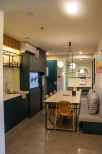 a kitchen and dining room with a table and chairs at lyf Cebu City managed by The Ascott Limited in Cebu City