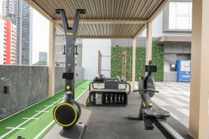 a gym with two treadmills and two tread machines at Newly Renovated - Days Inn by Wyndham Singapore Novena in Singapore