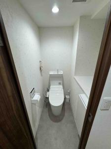 a bathroom with a toilet in a small room at Kame Ame House in Kameoka +46 photos