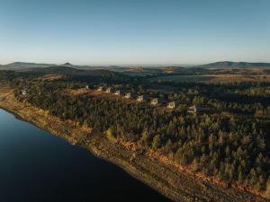 an aerial view of an island in the water at Wilderluxe Lake Keepit in Keepit +26 photos
