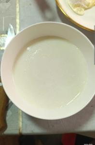 a white plate sitting on top of a table at Azamat Yurt Camp in Song-Kul
