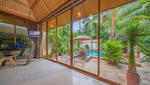 an image of a house with a large glass wall at Pattaya Bungalow III, Totally Private Pool in Pattaya South