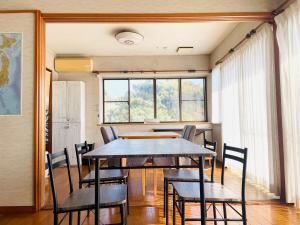 a dining room with a table and chairs at 蒼のSkyviewBase in Hiroshima +68 photos