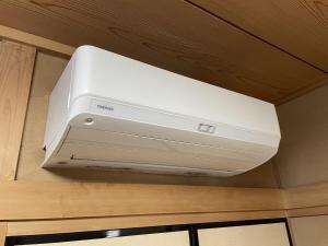 a white appliance is hanging from a ceiling at 蒼のSkyviewBase in Hiroshima