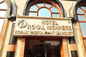 a hotel sign on the side of a building at hotel royal highness in Ahmedabad