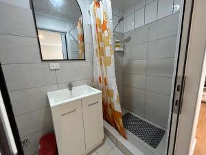 a bathroom with a sink and a shower at Spacious Stylish Coastal Escape in Tuncurry +47 photos