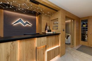 a bar in a wine cellar with wooden walls at Panorama Samnaun in Samnaun +71 photos