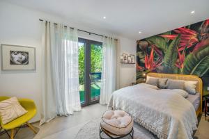 a bedroom with a large bed and a large window at Apartment Nest 20 in Ettenheim +20 photos