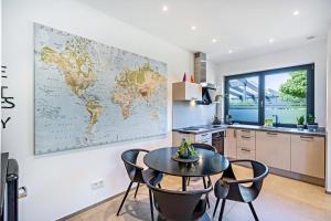 a kitchen with a map of the world on the wall at Apartment Nest 20 in Ettenheim