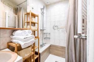 a bathroom with a shower and a sink at Regina - Duplex in Heart of Menton - Happy Rentals in Menton