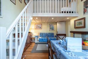 a living room with a staircase and a dining room at Regina - Duplex in Heart of Menton - Happy Rentals in Menton +17 photos