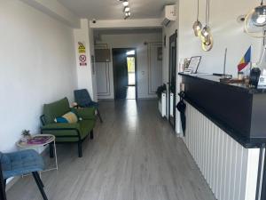 a hallway with a living room with a couch and chairs at Casa Acati Venus in Venus