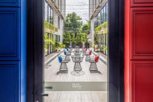 a poster of a table in the middle of a street at Blue Hippo & Red Crocodile Hotel in Bangna