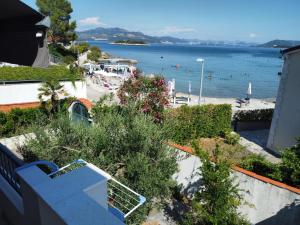 a view of the beach from the balcony of a house at Ema & Jakov in Sreser