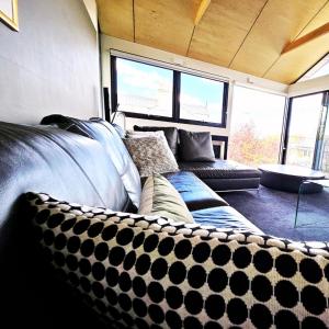 a living room with a couch at Fusion Townhouse-North Hobart in West Hobart
