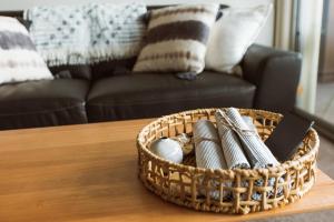 a basket on a table with eggs in it at Montage Apartment + Views + Location + Car Parking in Bellerive