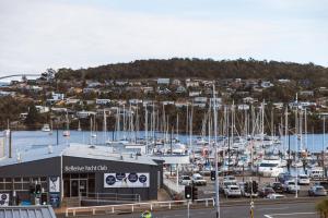 a marina with lots of boats in a harbor at Montage Apartment + Views + Location + Car Parking in Bellerive