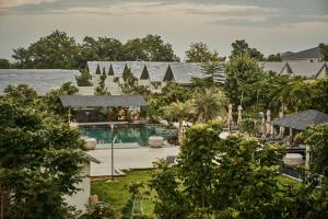 an aerial view of a resort with a swimming pool at Arth Resorts I Convention I Wellness in Moinabad