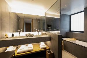 a bathroom with a sink and a large mirror at Muni Kyoto in Kyoto +96 photos