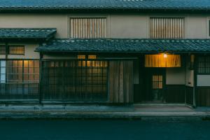 an asian house with windows and a street at 暇家 kaya in Yosano