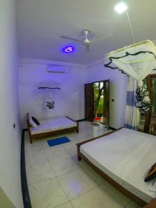 a bedroom with two beds in a room at Lake View Eco Lodge in Dambulla