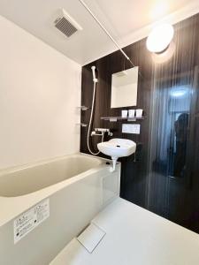 a bathroom with a sink and a bath tub at 北海道大学ENYA-n17 in Sapporo +60 photos