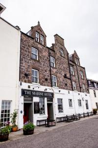 a building with a sign that reads the making hotel at The Marine Hotel in Stonehaven