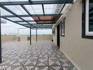 a room with a glass ceiling and a tiled floor at Hotel Seven Dreamers in Kākināda